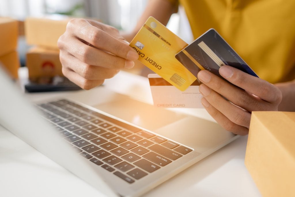 Close up hand man holding and choosing credit card to use